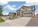 Charming two-story home featuring neutral paint, stone accents and a two-car garage at 9264 Biscay St, Commerce City, CO 80022