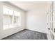 Home office featuring a large window, fresh white paint and neutral carpeting at 9264 Biscay St, Commerce City, CO 80022