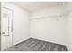 Walk-in closet featuring wire shelving and neutral carpeting at 9264 Biscay St, Commerce City, CO 80022