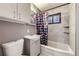 Tiled bathroom with tub and shower at 2391 Kingston St, Aurora, CO 80010