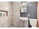 Modern bathroom featuring tiled walls and updated fixtures at 2391 Kingston St, Aurora, CO 80010