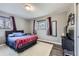 Bedroom with a large window, closet and a comfortable bed at 2391 Kingston St, Aurora, CO 80010