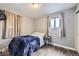 Cozy bedroom with wood-look floors and natural light at 2391 Kingston St, Aurora, CO 80010