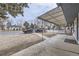 Covered front porch with seating and a view of the street at 2391 Kingston St, Aurora, CO 80010
