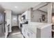 Well-lit kitchen featuring white cabinetry and stainless steel appliances at 2391 Kingston St, Aurora, CO 80010