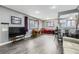 Open-concept living space with hardwood floors, dining area and breakfast bar at 2391 Kingston St, Aurora, CO 80010