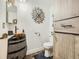 Small bathroom with a copper sink and wood-look vanity at 11462 Iola St, Commerce City, CO 80640