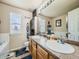 Clean bathroom with double vanity and a bathtub at 11462 Iola St, Commerce City, CO 80640