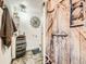 Rustic-chic bathroom with a unique barrel sink and wood-themed accents at 11462 Iola St, Commerce City, CO 80640