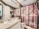 Clean bathroom with shower/tub combo and updated vanity at 11462 Iola St, Commerce City, CO 80640