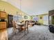 Dining area adjacent to kitchen and living room at 11462 Iola St, Commerce City, CO 80640