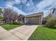 House exterior showcasing landscaping and driveway at 11462 Iola St, Commerce City, CO 80640