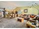 Open concept living and dining area with comfy seating at 11462 Iola St, Commerce City, CO 80640