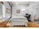 Bedroom with hardwood floors, exposed duct work, and a desk at 1401 Wewatta St # 311, Denver, CO 80202