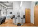 Compact dining area with bar seating next to a doorway and leading to the living room at 1401 Wewatta St # 311, Denver, CO 80202