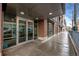 Exterior entrance featuring glass doors, brick facade, and building number at 1401 Wewatta St # 311, Denver, CO 80202