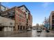 Brick exterior of the D & F Tower Residences building with a corner warehouse sign at 1401 Wewatta St # 311, Denver, CO 80202