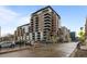 Modern brick condo building featuring multiple balconies, city views, and street access at 1401 Wewatta St # 311, Denver, CO 80202
