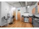Kitchen with stainless steel appliances and granite countertops, adjoining a small breakfast nook at 1401 Wewatta St # 311, Denver, CO 80202