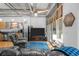 Well-lit living room with stainless steel appliances, a TV, and balcony access at 1401 Wewatta St # 311, Denver, CO 80202