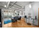 Spacious layout featuring modern industrial accents, balcony access, seating area, and dining area at 1401 Wewatta St # 311, Denver, CO 80202