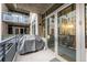 Outdoor patio with grill featuring views of neighboring buildings and access to the interior at 1401 Wewatta St # 311, Denver, CO 80202