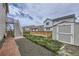 Fenced backyard featuring a shed and stairs to the upper deck at 9227 Salida St, Commerce City, CO 80022