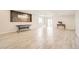 Expansive basement featuring tiled floors, recessed lighting, stylish accent wall and french doors to the exterior at 9227 Salida St, Commerce City, CO 80022