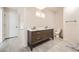 Modern bathroom with a stylish double vanity, tile floors and recessed lighting at 9227 Salida St, Commerce City, CO 80022