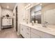 Bright bathroom showcasing a double vanity, quartz countertops, modern fixtures, and stylish cabinetry at 9227 Salida St, Commerce City, CO 80022
