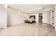 Modern bedroom with recessed lighting, tile floors and a comfortable queen bed at 9227 Salida St, Commerce City, CO 80022
