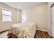 Well-lit bedroom features a comfortable bed, hardwood floors and a closet for storage, creating a cozy retreat at 9227 Salida St, Commerce City, CO 80022
