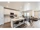 Bright kitchen with an island, barstool seating, and stainless steel appliances at 9227 Salida St, Commerce City, CO 80022