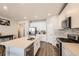 Spacious kitchen boasts a large island, stainless steel appliances, and ample counter space at 9227 Salida St, Commerce City, CO 80022