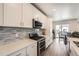 Well-equipped kitchen with stainless appliances, a tile backsplash, and sleek countertops at 9227 Salida St, Commerce City, CO 80022