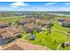 Scenic aerial view of the property highlighting the community park, gazebo, and nearby lake at 6202 Kilmer Loop # 202, Golden, CO 80403