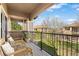 Inviting balcony with seating overlooking a green lawn, perfect for enjoying outdoor relaxation at 6202 Kilmer Loop # 202, Golden, CO 80403
