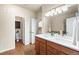 Bathroom featuring double sink vanity, ample cabinet space, and toilet room at 6202 Kilmer Loop # 202, Golden, CO 80403