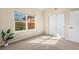 Well-lit bedroom features closet, neutral colors, and large window at 6202 Kilmer Loop # 202, Golden, CO 80403