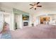 Spacious living room featuring a fireplace, tv, and an open layout, ideal for entertaining and relaxation at 6202 Kilmer Loop # 202, Golden, CO 80403