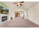 Inviting living area featuring a fireplace and open layout, seamlessly connected to the kitchen for easy entertaining at 6202 Kilmer Loop # 202, Golden, CO 80403