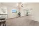 Bright and airy living room featuring neutral colors, large windows and adjacent areas at 6202 Kilmer Loop # 202, Golden, CO 80403