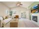 Bright living room boasts a fireplace, sliding glass doors, and neutral tones, perfect for relaxation and entertaining at 6202 Kilmer Loop # 202, Golden, CO 80403