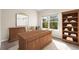 Cozy office with a wooden desk, chair, bookcase, and a window offering natural light at 6202 Kilmer Loop # 202, Golden, CO 80403