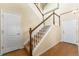 Traditional staircase with wood and white trim, carpeted steps, leading to the upper level of the home at 6202 Kilmer Loop # 202, Golden, CO 80403