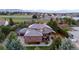 Aerial view of a home with manicured lawn and mountain views at 5925 Zinnia Ct, Arvada, CO 80004