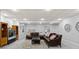 Finished basement featuring a comfortable seating area with leather couches and layered rug at 5925 Zinnia Ct, Arvada, CO 80004