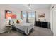 Cozy bedroom with bright natural light, ceiling fan, and decor at 5925 Zinnia Ct, Arvada, CO 80004