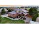 Beautiful brick home featuring professional landscaping and a tile roof at 5925 Zinnia Ct, Arvada, CO 80004