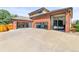 Spacious garage with multiple bays and ample parking for vehicles and trailers at 5925 Zinnia Ct, Arvada, CO 80004